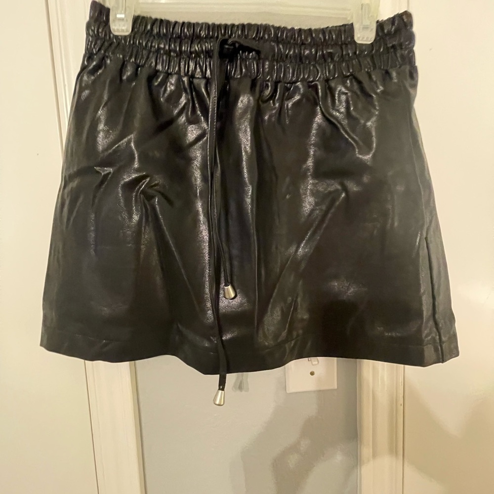 Black leather mini skirt